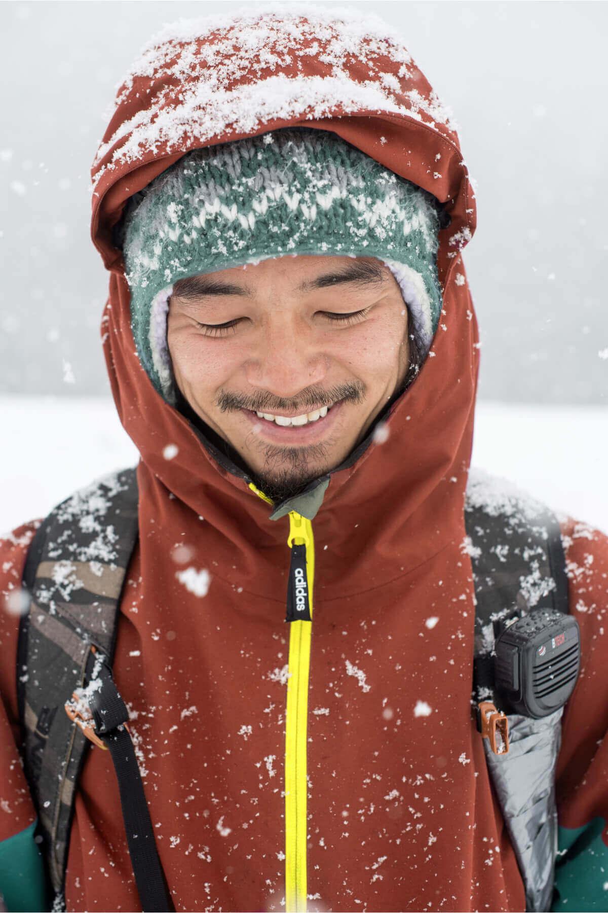 Man smiling and looking down