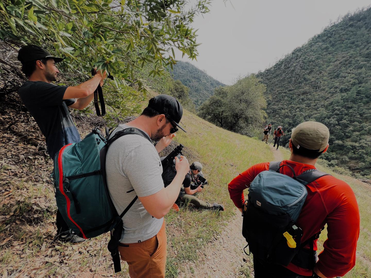 Photographers on hill with group